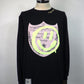 STUD MUFFIN　コットン天竺 ラベルスマイル発泡プリントLS Tシャツ　524-02819-BK